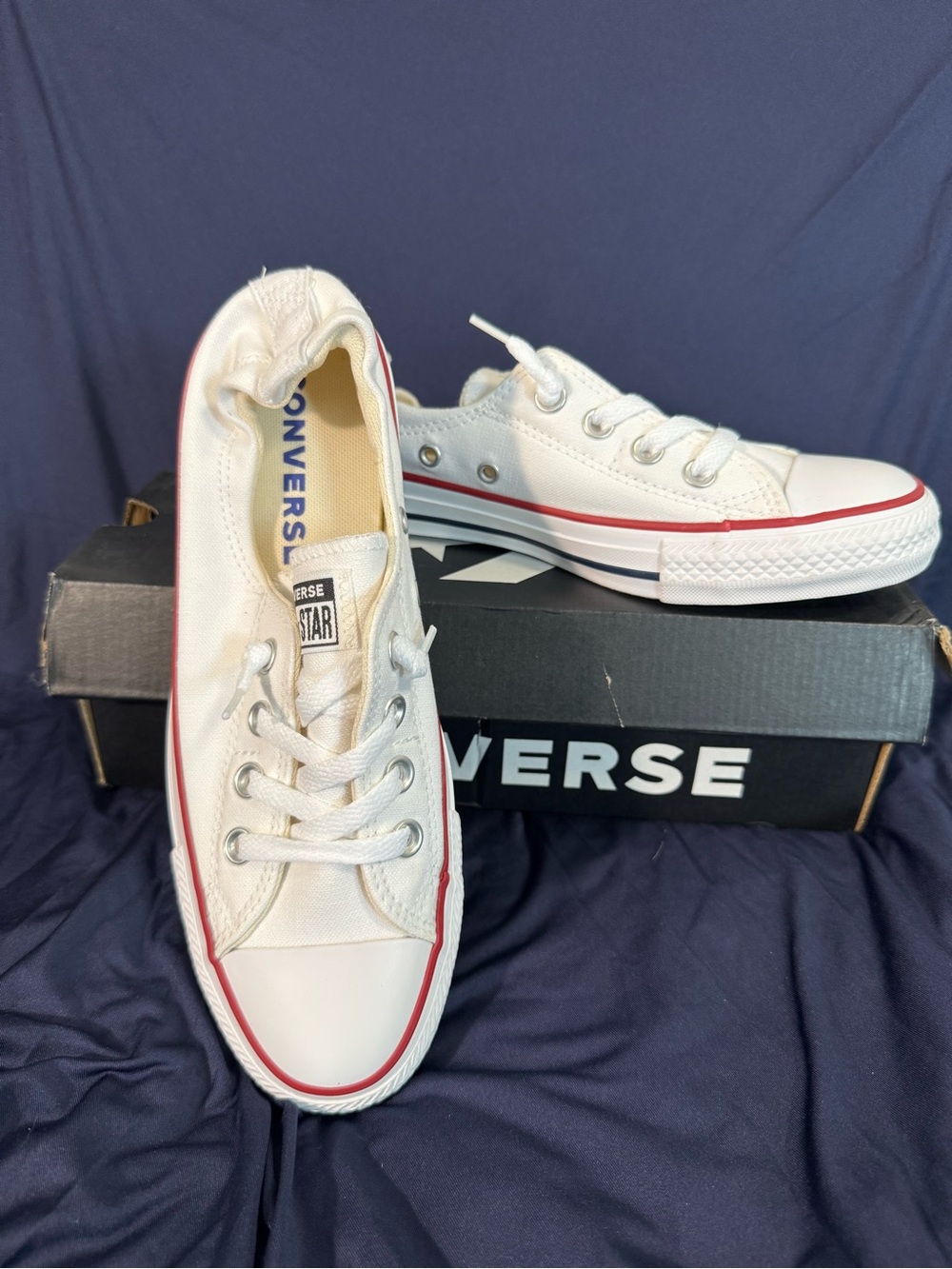 Converse Low Top Sneakers in White with Red Stripe